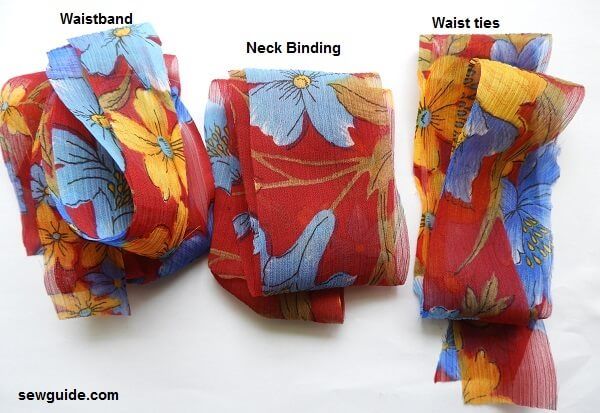 cut fabric strips for waistband, neckbinding and waistties.
