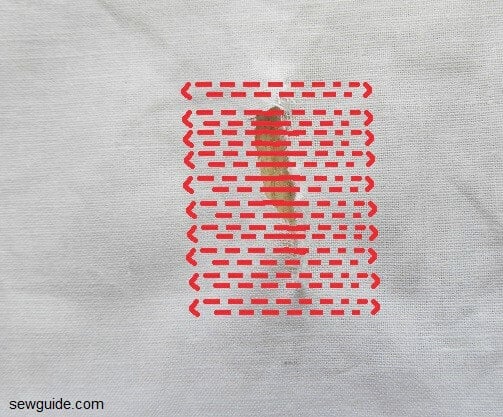 darning stitches made over a hole