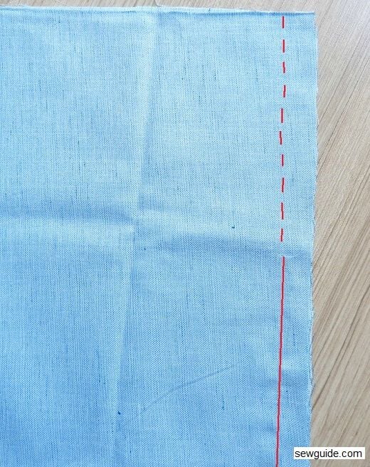 make basting stitches where the zipper should be; sew the rest of the seam