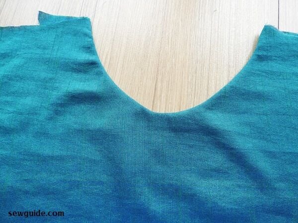 Neckline finished with facing