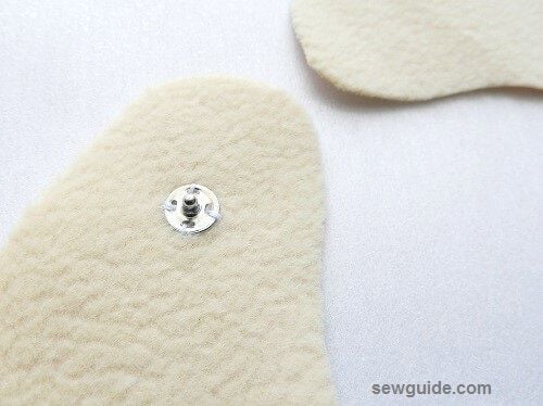 Attach snap buttons on either sides of the inner material