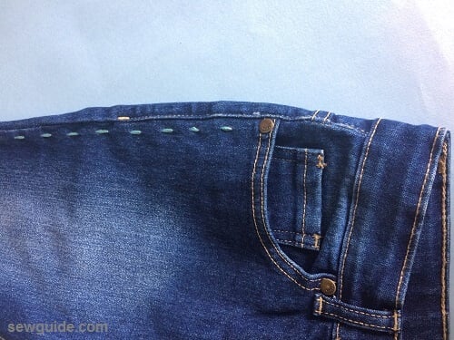 embellish old jeans with small running stitches on the outer seam