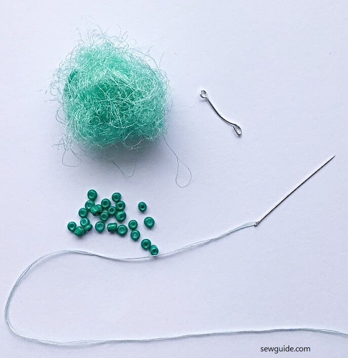 felt fiber or make fiber to form a bead