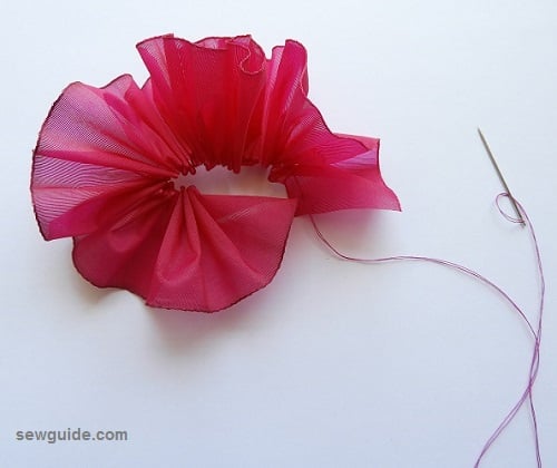 gather the stitch to form a rose shape