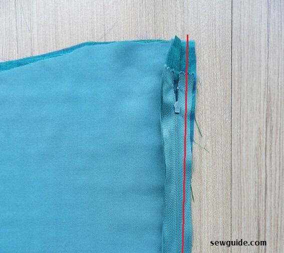 sew the zipper to the seam opening along the seam allowance