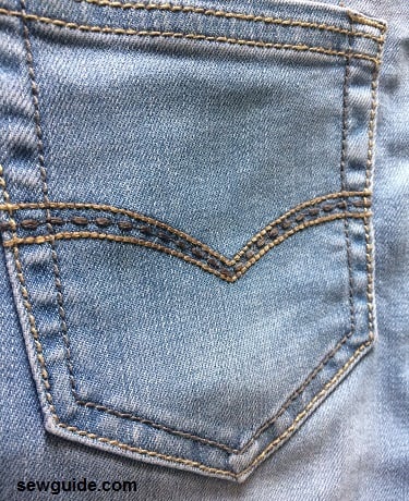 old jeans can be made to look better with small decortive stitches made on pockets