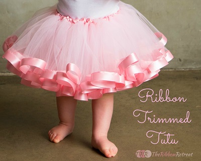Satin ribbon trim at the hem of a fluffy ballerina skirt