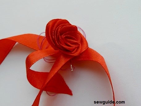 continue rolling the rose to form the ribbon rose