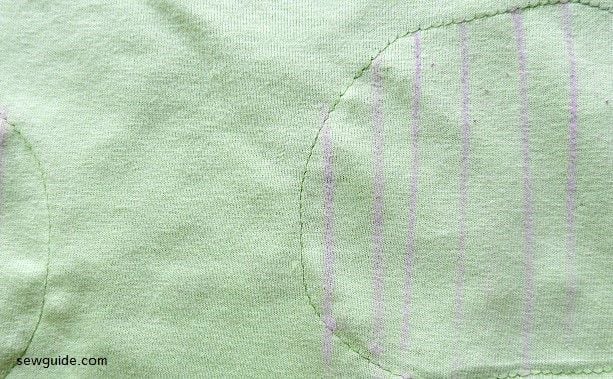 Sew the patch fabric to the back and then mark and cut inside 