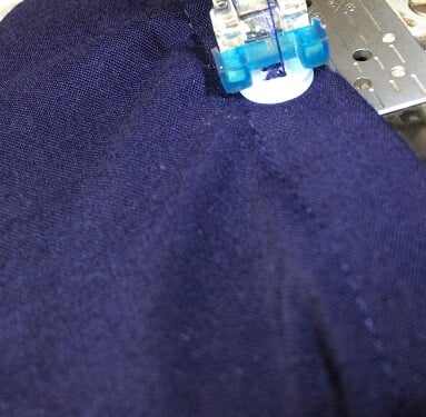 use a button foot to sew the buttons on the shirt