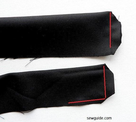 fold the waistband fabric by the middle ., rightsides to the inside